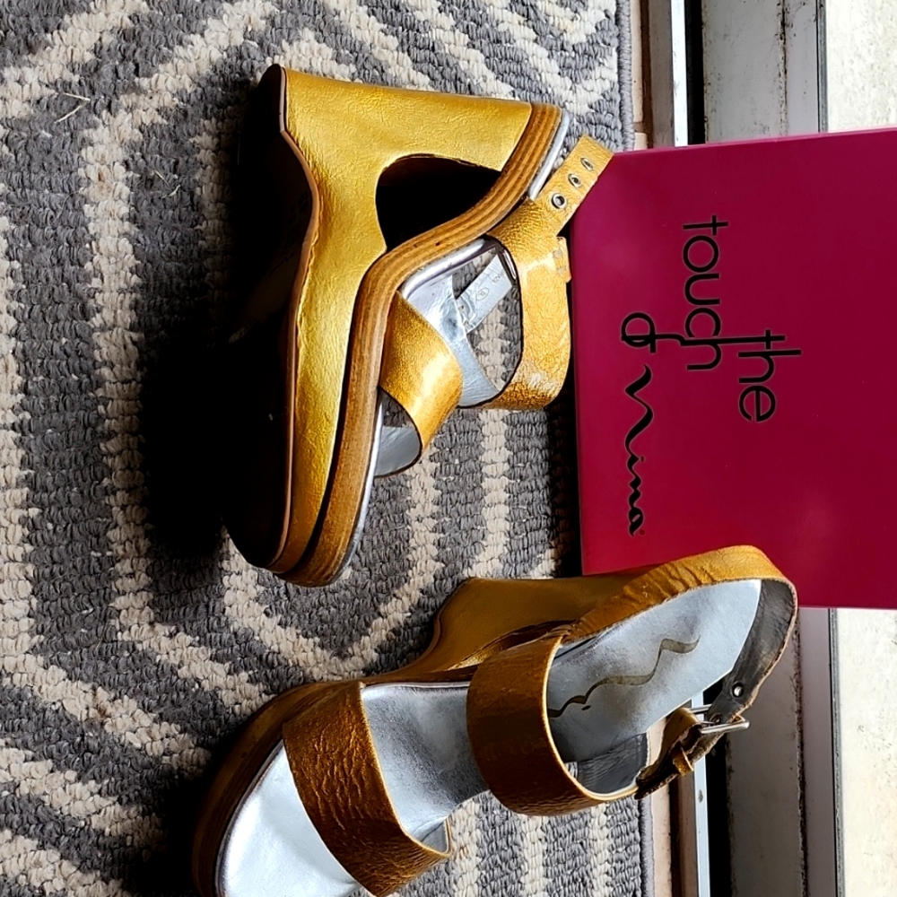 Ladies Gold sandles w/ wood accents. Leather uppers and soles might be leather.